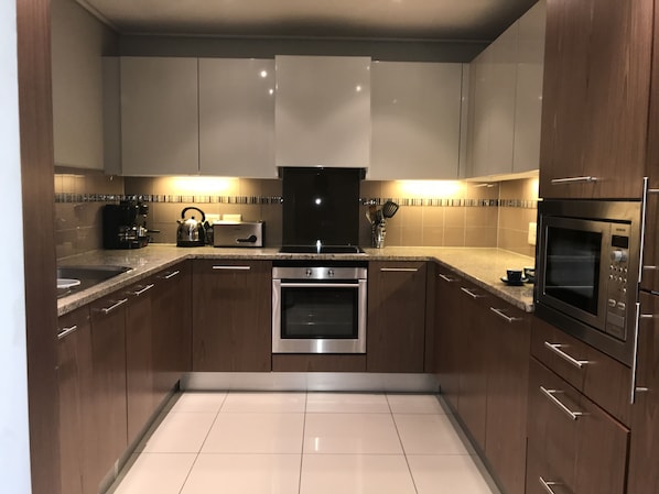 2 Bedroom Apartment | Private kitchen | Full-sized fridge, microwave, oven, stovetop