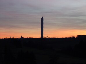 A tall tower silhouetted against a sunset sky. - spacious holiday apartment "Turm im Blick" in attractive surroundings, (Dietingen)