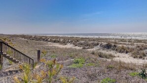 A beach view with a wooden staircase leading down to the sand. - Short Walk to Shops, Restaurants & Beach Access,Pet Friendly, Private fenced in yard (Folly Beach)