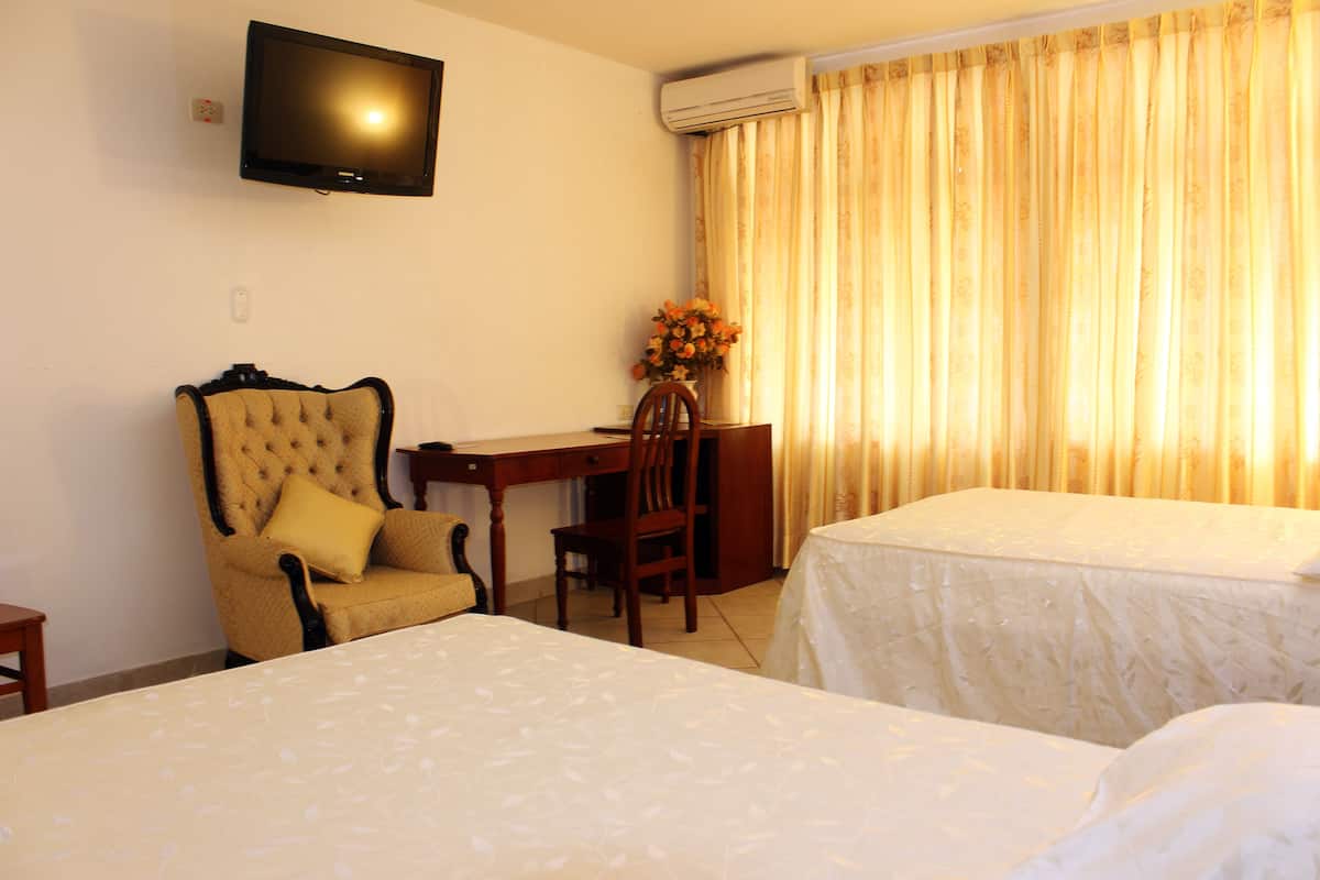 Twin Room, 2 Double Beds | Minibar, in-room safe, individually decorated, individually furnished