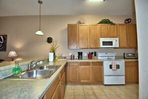 Enjoy cooking in this well-equipped kitchen with a microwave, oven, and toaster.