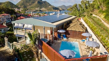 Outdoor pool, open 8:00 AM to 8:00 PM, pool umbrellas, pool loungers
