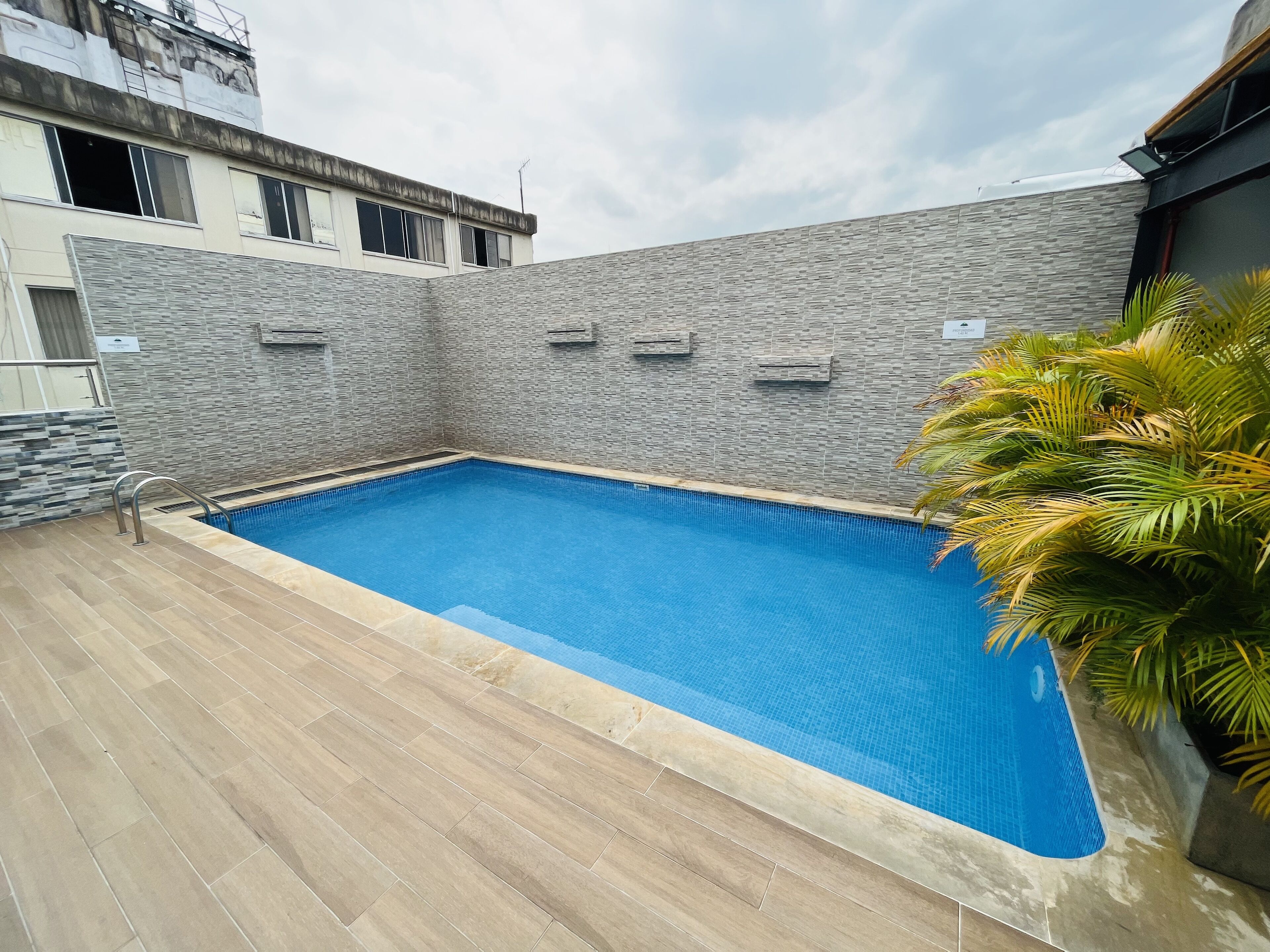 Outdoor pool, open 7:00 AM to 6:00 PM, pool loungers