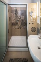 Shower, free toiletries, hair dryer, slippers