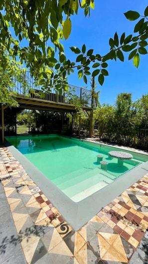 Indoor pool, outdoor pool, open 7:00 AM to 11:00 PM, pool umbrellas