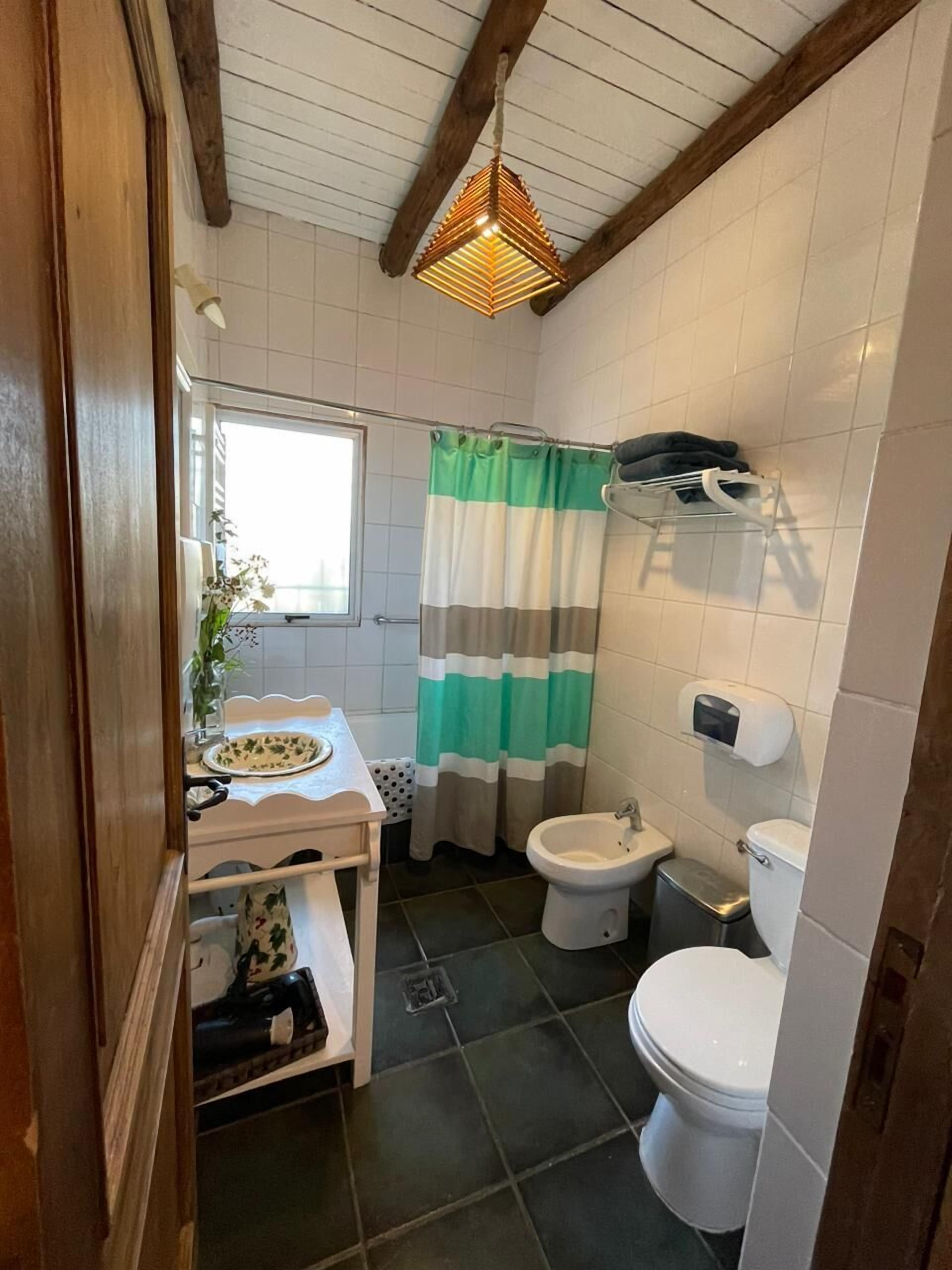 superior double room, 1 king bed | bathroom | combined shower/bathtub, designer toiletries, hair dryer, towels