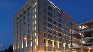 A multi-story hotel with illuminated signage for Fairfield Inn & Suites and Brownplace Suites. - Fairfield Inn & Suites by Marriott Dallas Downtown (Dallas)