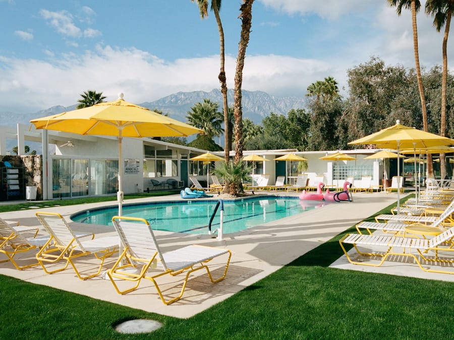 Outdoor pool, open 7 AM to 10 PM, pool umbrellas, sun loungers