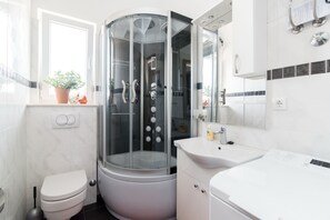 Shower, hair dryer, towels, soap