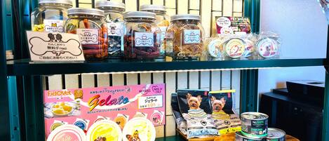 A DOG BAR with various dog treats and pet products on display.