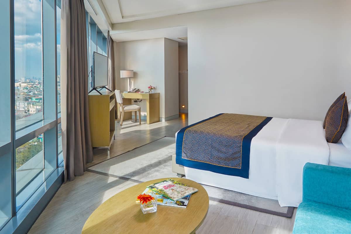 runway junior suite with living area | 1 bedroom, minibar, in-room safe, blackout curtains