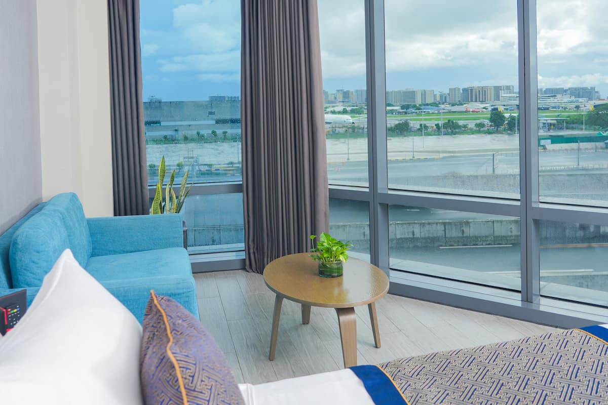 runway junior suite with living area | 1 bedroom, minibar, in-room safe, blackout curtains