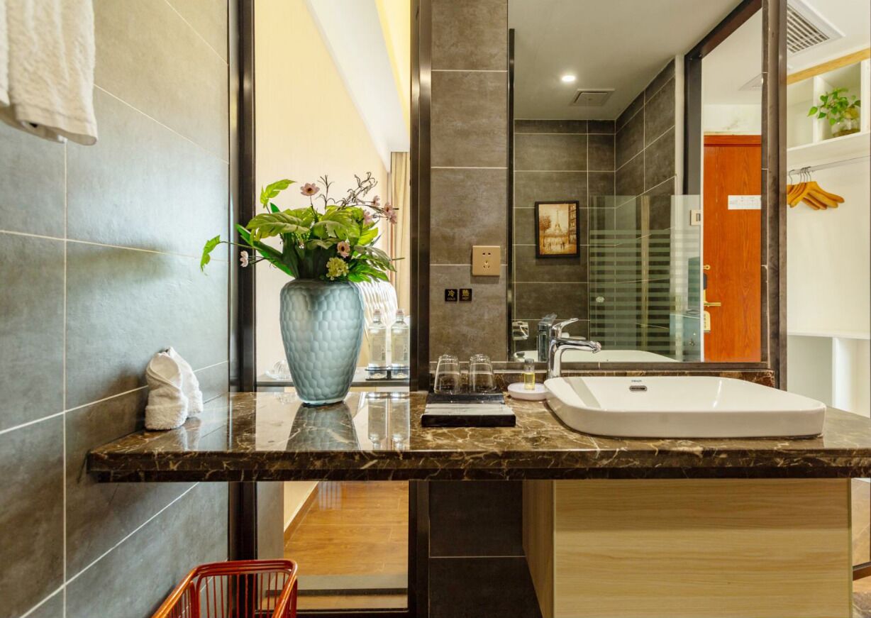 deluxe double room, 1 king bed, balcony, river view | bathroom | rainfall showerhead, free toiletries, hair dryer, slippers