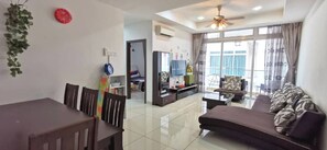 Family Apartment, 3 Bedrooms | Living area | 40-inch LED TV with digital channels, TV, DVD player