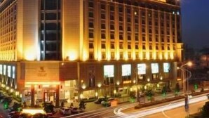 A large hotel with a prominent dome and multiple floors. - Fenglin International Hotel (Yulin)
