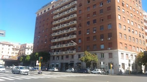 A multi-story building with a consistent architectural style, featuring balconies on each floor. - B&B Easy (Rome)