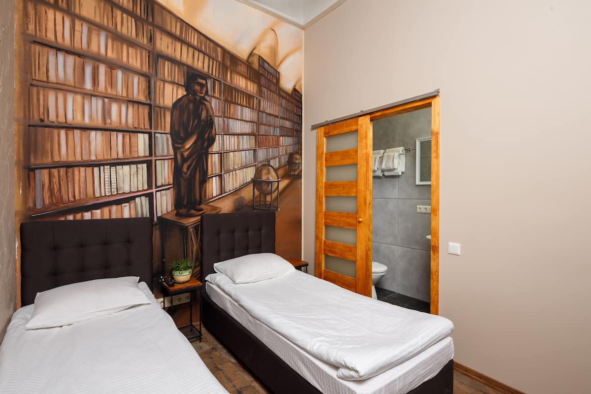Economy Twin Room, 2 Twin Beds | Desk, soundproofing, iron/ironing board (on request), WiFi (free)