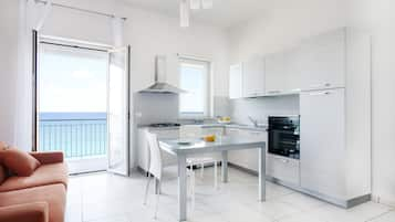 Deluxe Apartment, 1 Bedroom, Sea View | 1 bedroom, premium bedding, in-room safe, iron/ironing board