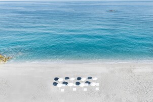 On the beach, sun loungers, beach umbrellas, beach towels