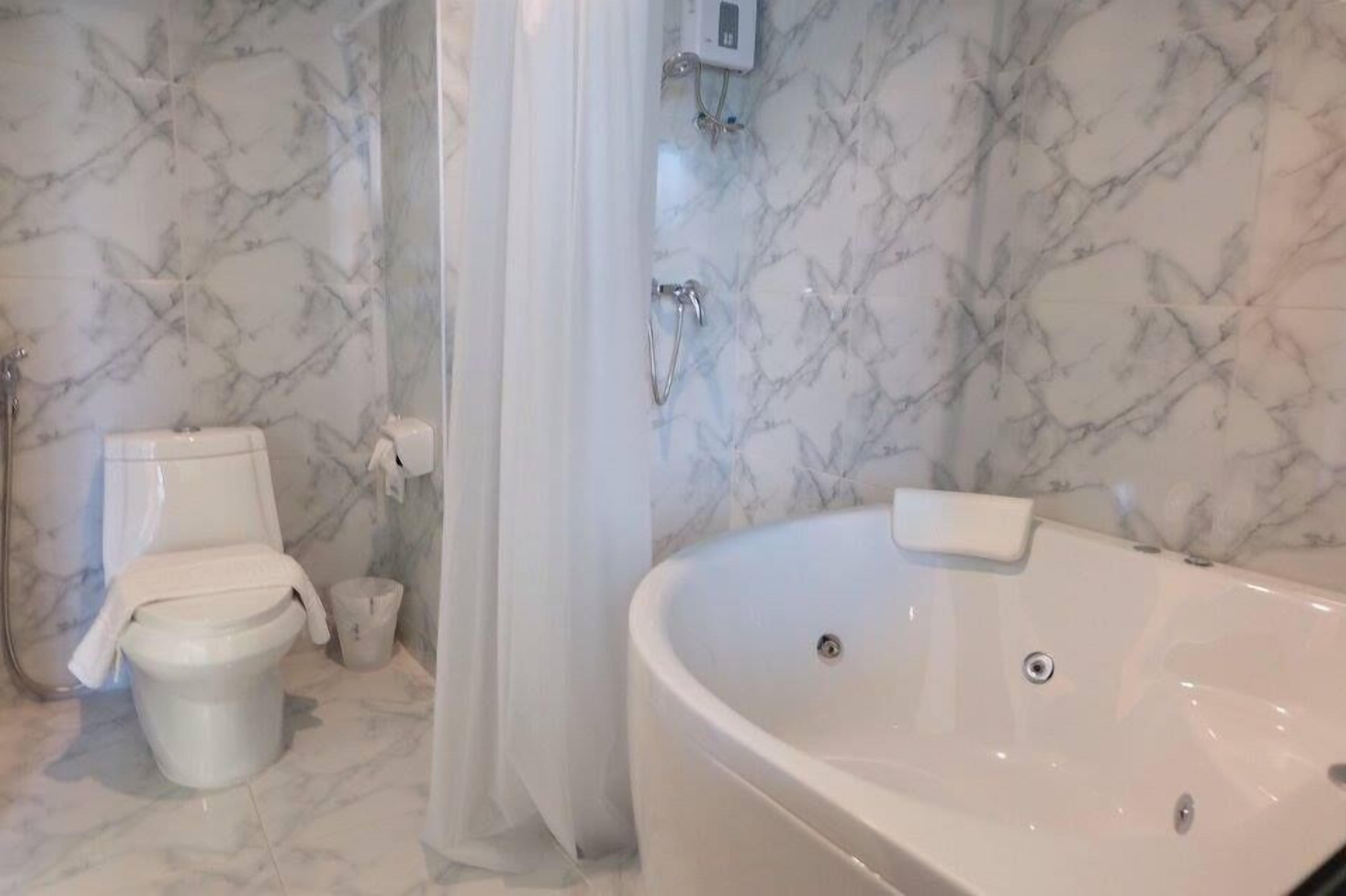 designer toiletries, hair dryer, bathrobes, towels