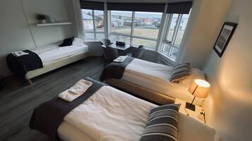 Economy Quadruple Room, Shared Bathroom (103) | Desk, blackout curtains, iron/ironing board, free WiFi