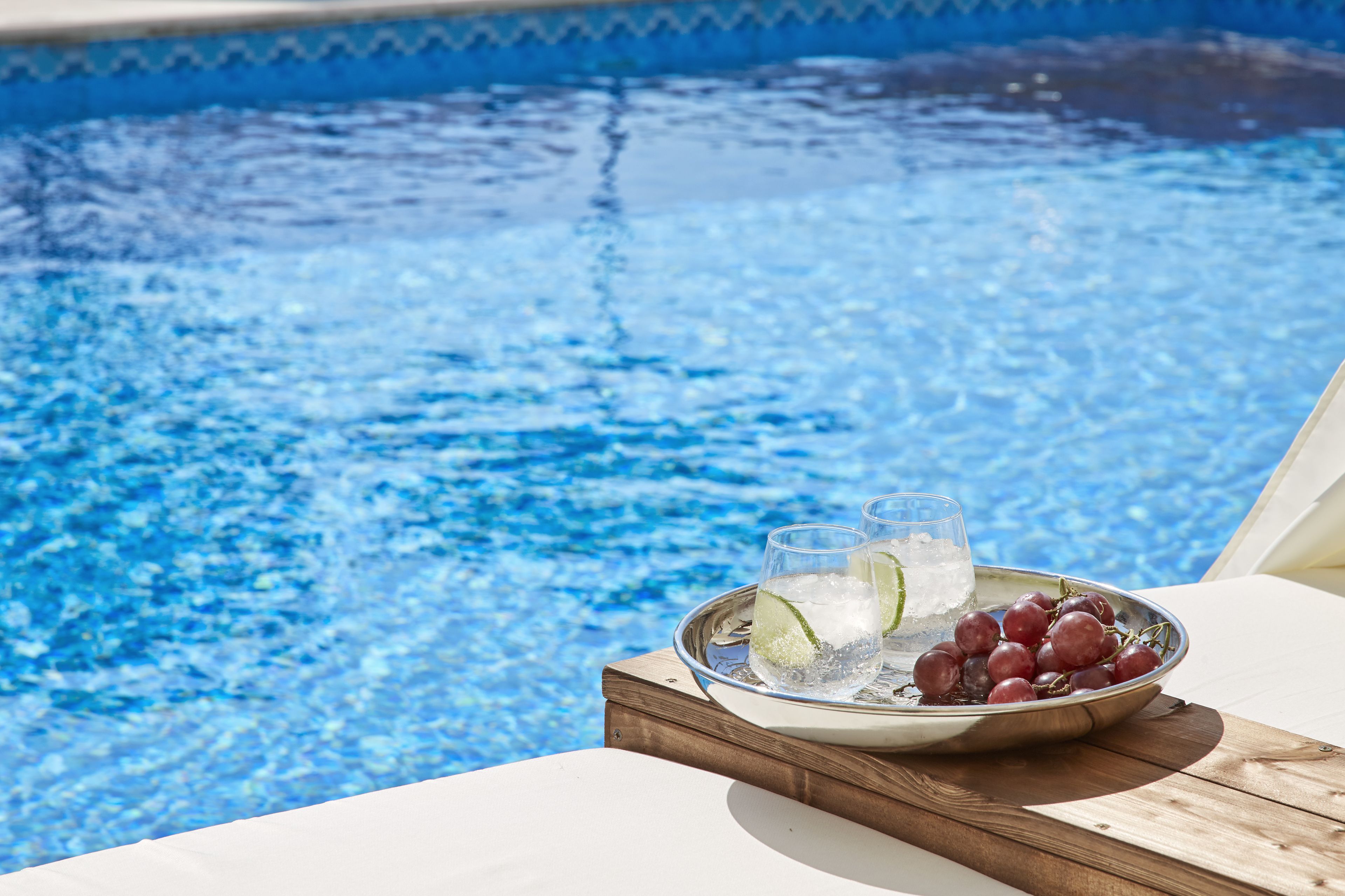 seasonal outdoor pool, open 11:00 am to 6:30 pm, pool umbrellas