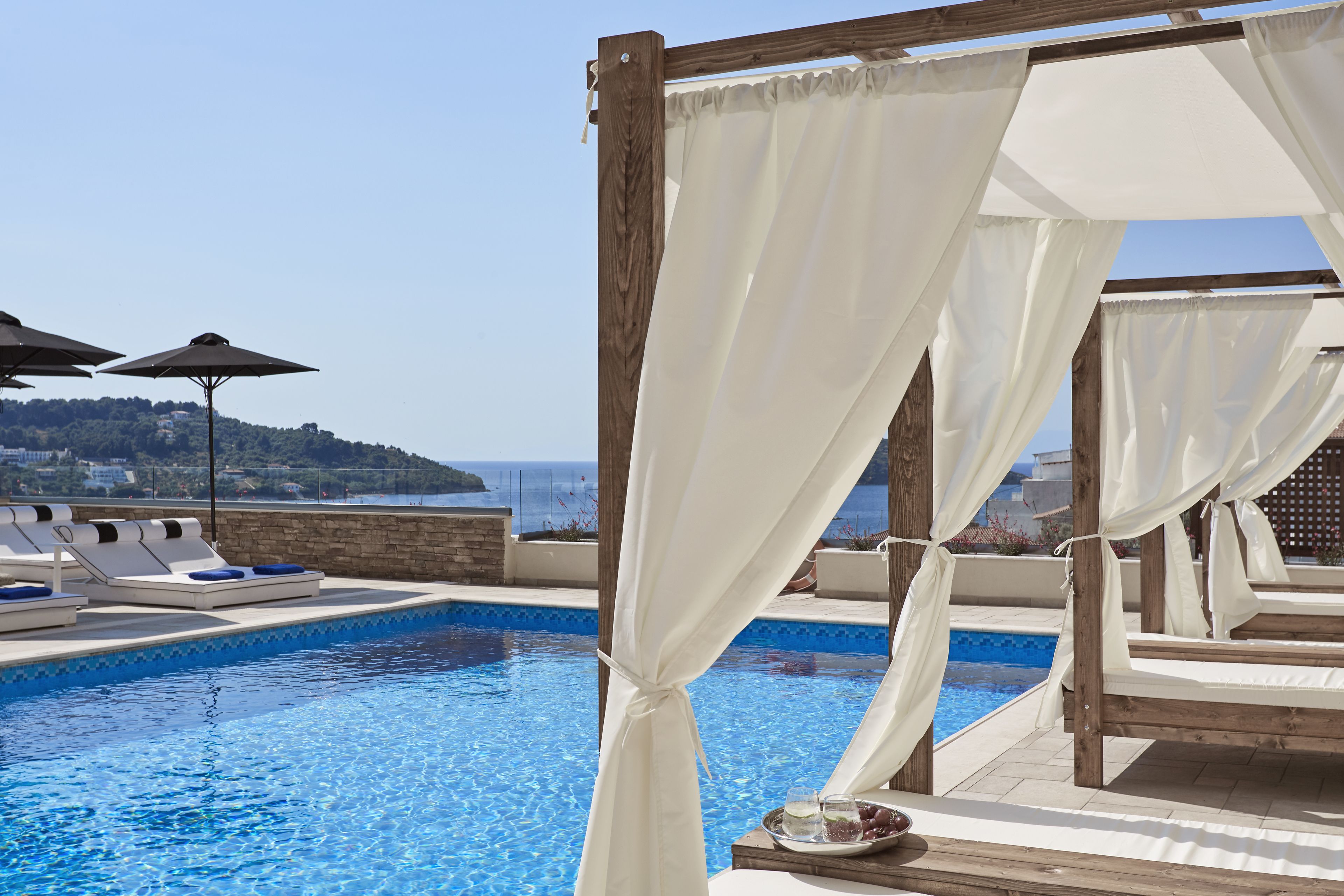 seasonal outdoor pool, open 11:00 am to 6:30 pm, pool umbrellas