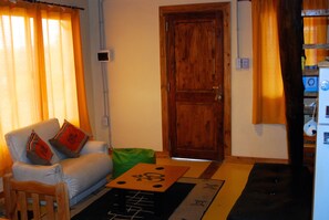 Apartment, 2 Bedrooms | Living area | Flat-screen TV