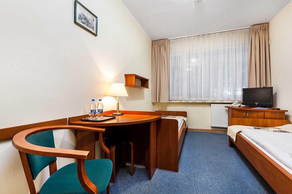 economy twin room, ground floor (indoor ice rink view) | 1 bedroom, iron/ironing board, free wifi, bed sheets