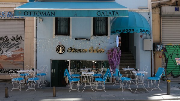 A restaurant named "Ottoman Galata" with outdoor seating and a staircase leading to the entrance. - Galata Moon Hotel  (Istanbul)