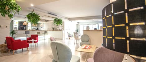 A modern interior with a living area, kitchen, and dining space.