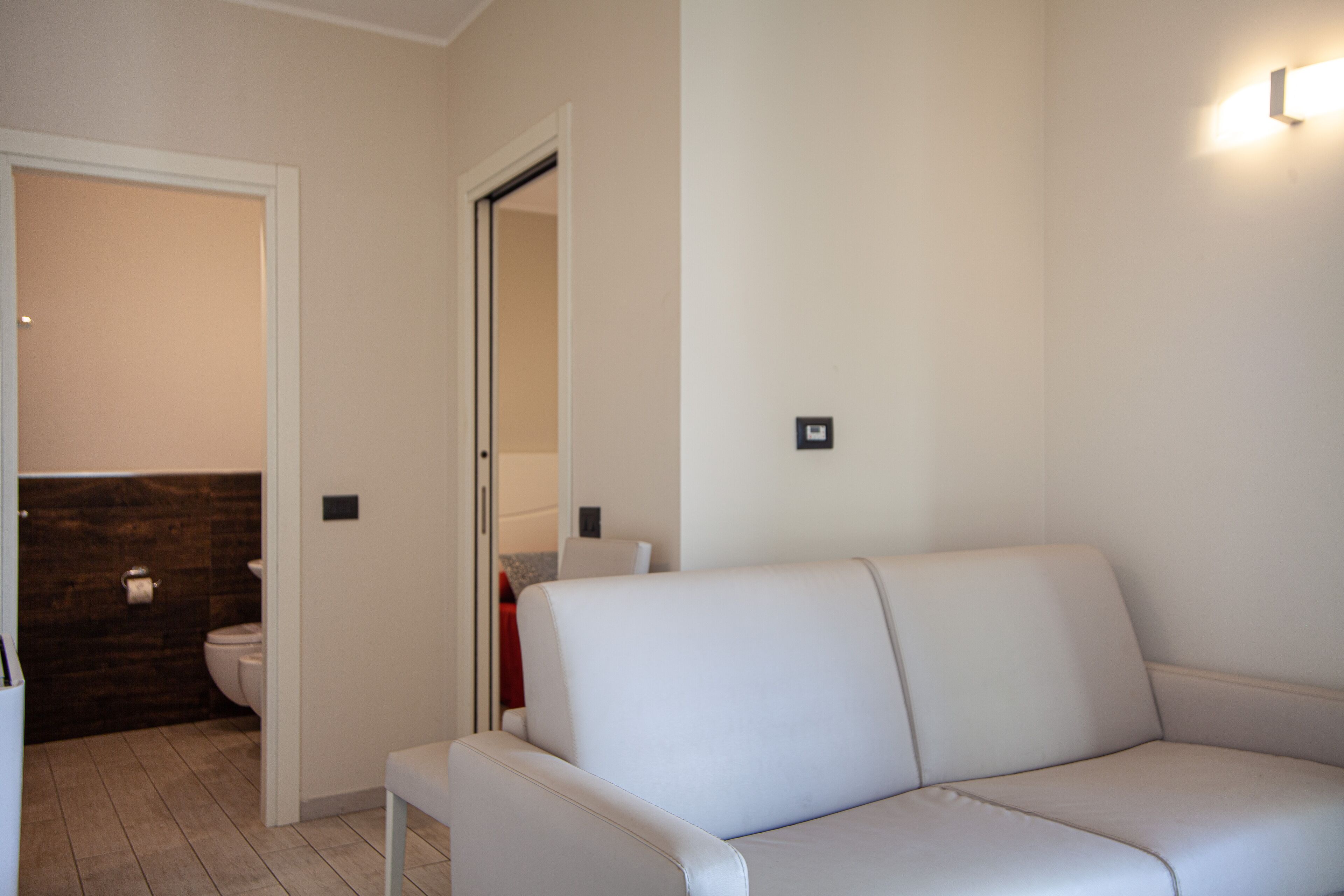 family room | 1 bedroom, minibar, in-room safe, desk