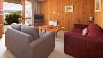 Apartment, 1 Bedroom | Living room | Flat-screen TV, DVD player