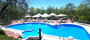 Seasonal outdoor pool, pool umbrellas, sun loungers