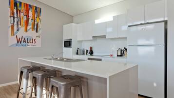 Townhome, 4 Bedrooms | Private kitchen | Fridge, microwave, oven, stovetop