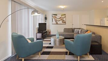 Apartment, 3 Bedrooms | Living room | Flat-screen TV, DVD player