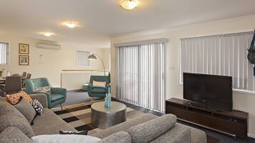 Apartment, 3 Bedrooms | Living room | Flat-screen TV, DVD player