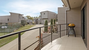 Enjoy al fresco dining on the balcony with a barbecue grill.