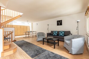 Apartment, City View, Tower | Living area | Flat-screen TV
