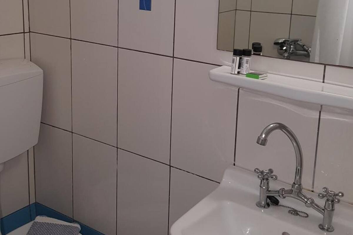 shower, designer toiletries, hair dryer, towels