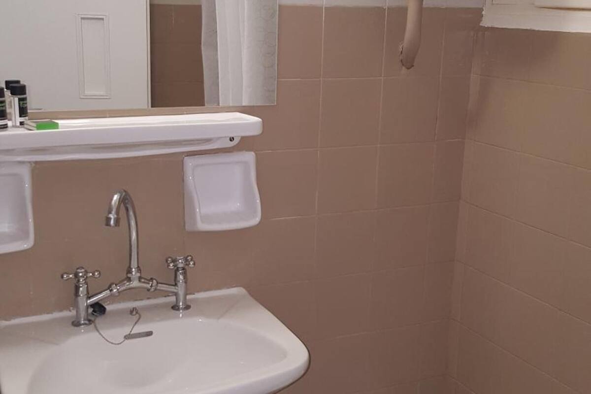 shower, designer toiletries, hair dryer, towels