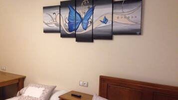 Triple Room | Desk, blackout drapes, iron/ironing board, free cribs/infant beds