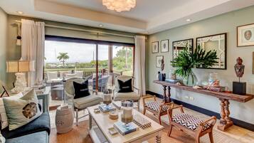 Superior Triple Room, 3 Bedrooms, Ocean View | Living area | TV