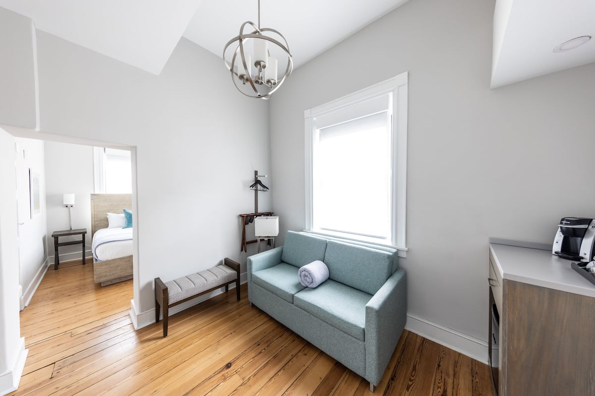 Deluxe Suite, 1 Queen Bed with Sofa bed | Living area | Flat-screen TV