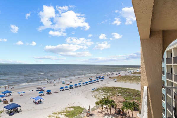 Enjoy stunning ocean views from your balcony overlooking the beach.