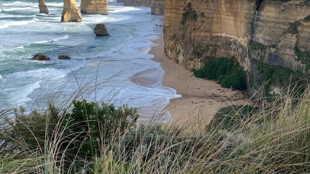 A coastal landscape with prominent rock formations and a sandy beach. - Jan Juc Beach Break - Walk to Beach, Pet Friendly (Jan Juc)