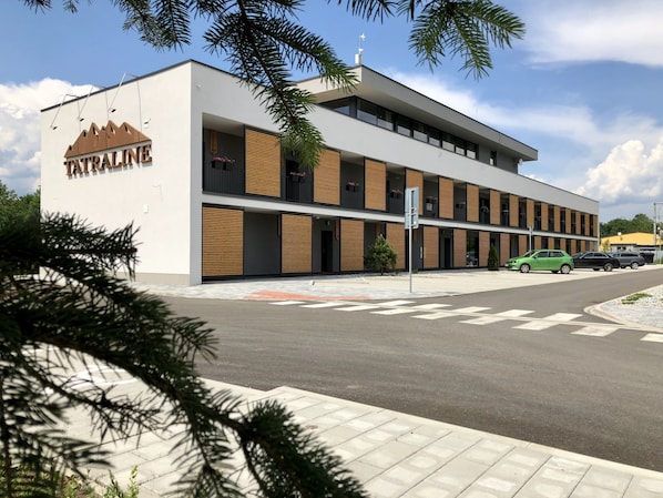 A modern building with a sign reading "TATRALINE". - Tatraline (Liptovsky Mikulas)
