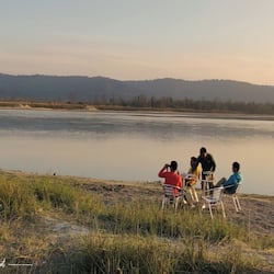 Guests can enjoy serene lake views from a scenic table setting.
