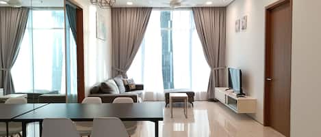 Exclusive Apartment, 3 Bedrooms | Living area | 40-inch flat-screen TV with cable channels, TV
