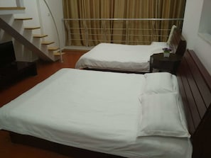 Triple Room | Minibar, desk, blackout drapes, iron/ironing board